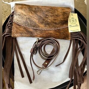 Hair on hide leather clutch bag with crossbody strap